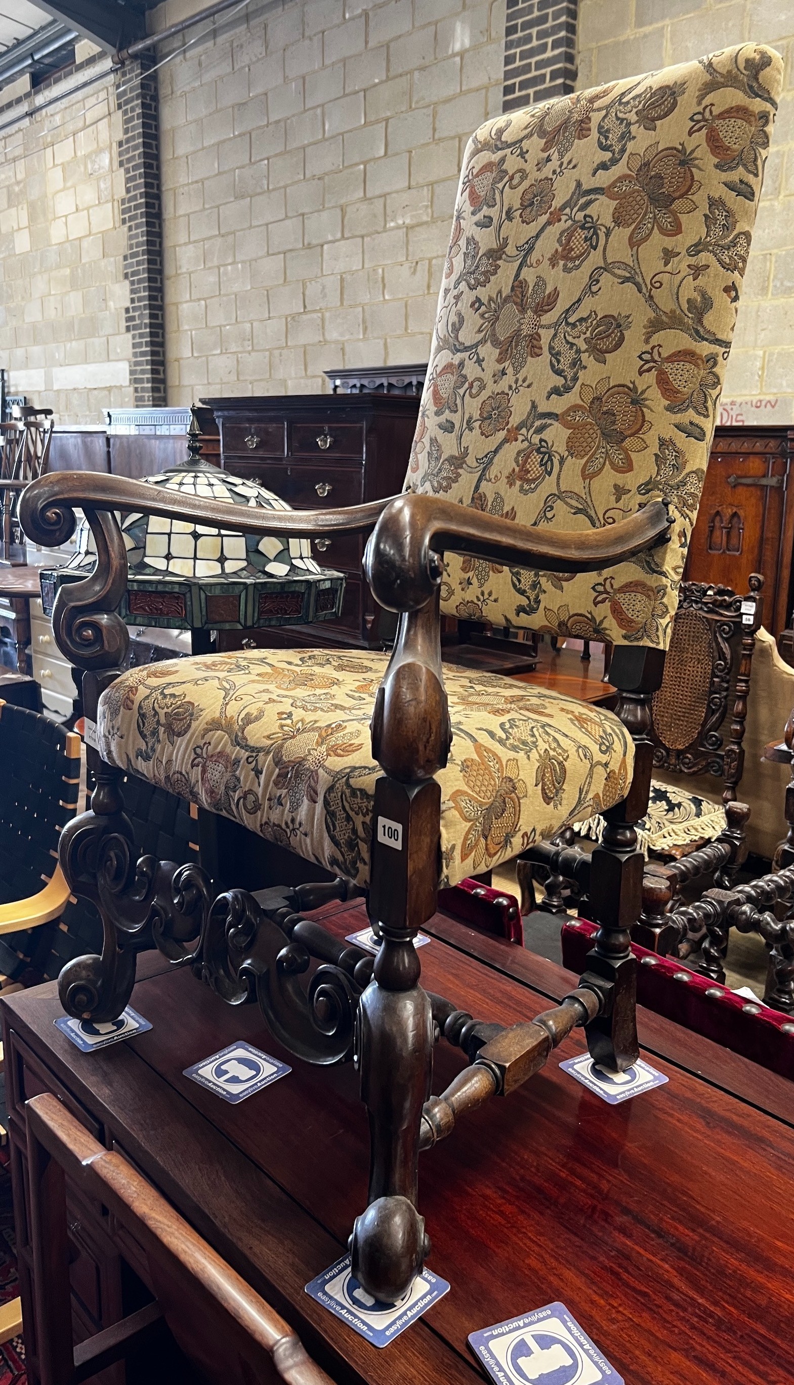 A reproduction Jacobean style mahogany upholstered elbow chair, width 64cm, depth 51cm, height 170cm